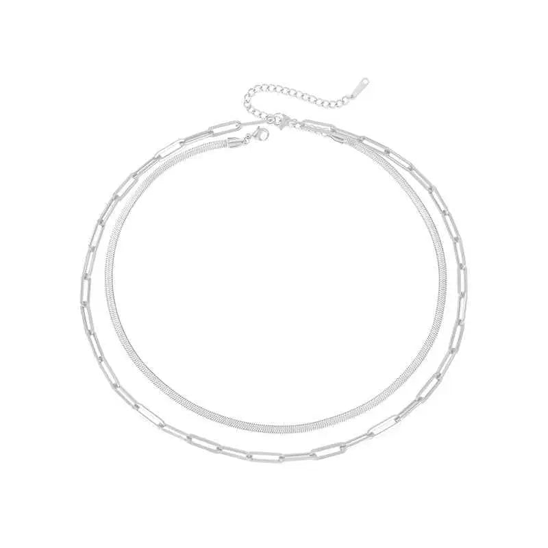 Silver two-layer chain necklace combining paperclip and snake link designs paired with 14k gold chain necklace Silver