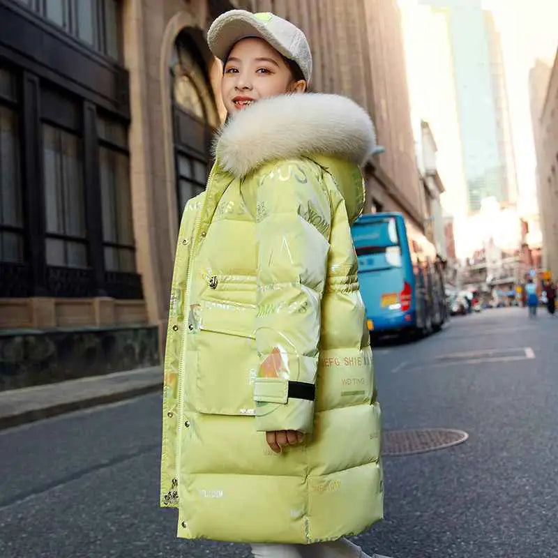 A bright lime green kids long down padded winter coat with a fluffy white fur-lined hood and reflective graphic prints Yellow