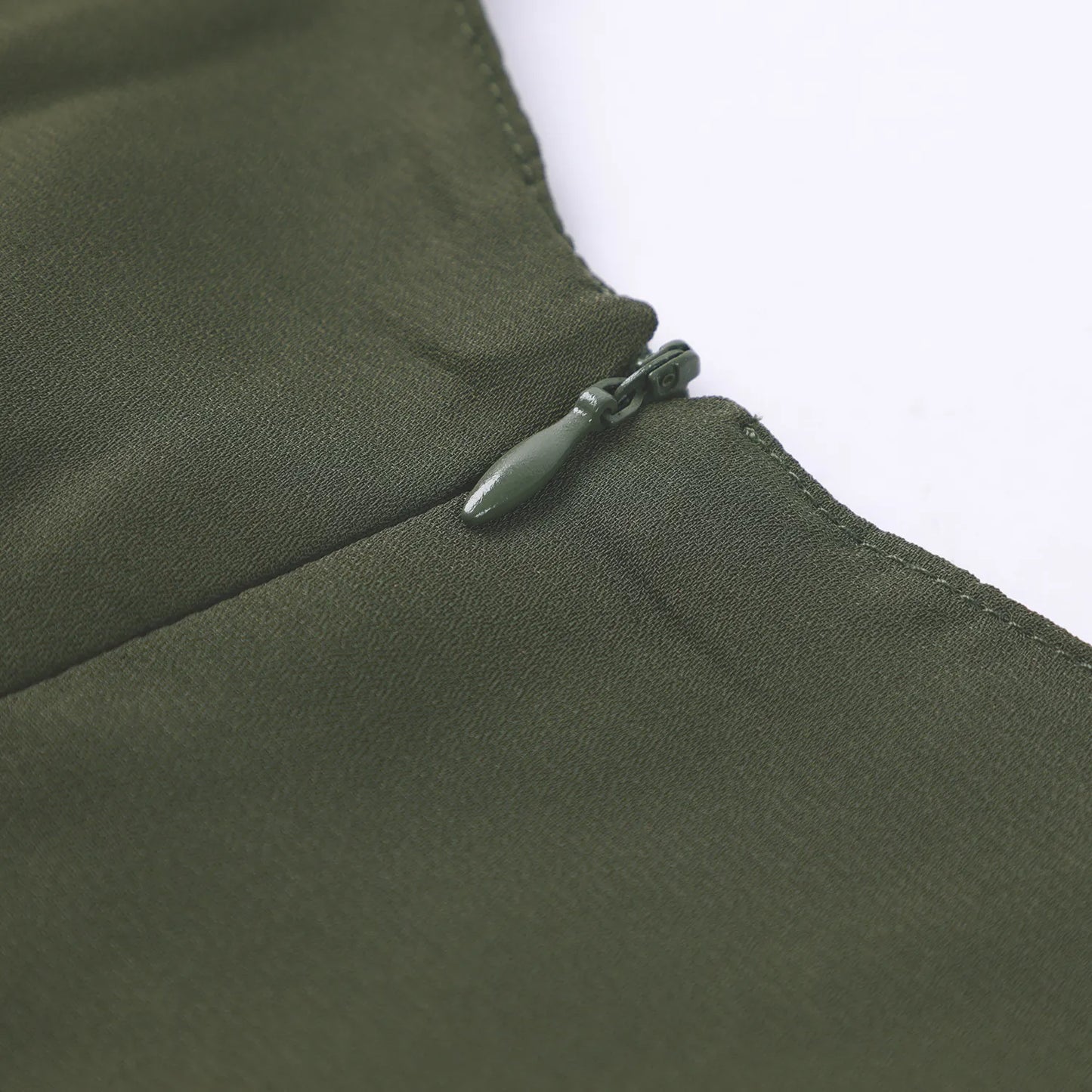 Gilded Printed Elegant Abaya by Trend Den featuring a close-up of a green zipper detail on soft fabric.