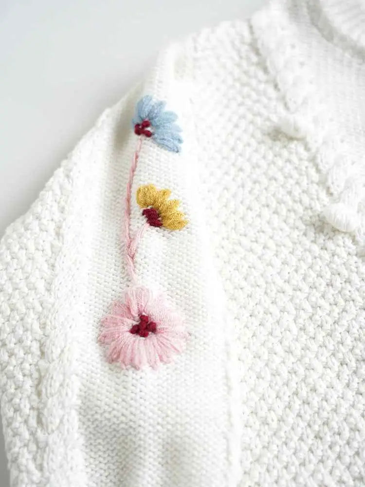 Baby girls hand-embroidered floral cotton sweater in white with delicate pastel flowers by trend den