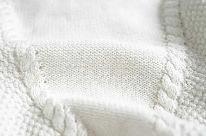 Baby girls hand-embroidered floral cotton sweater with white knitted fabric and textured cable-knit border