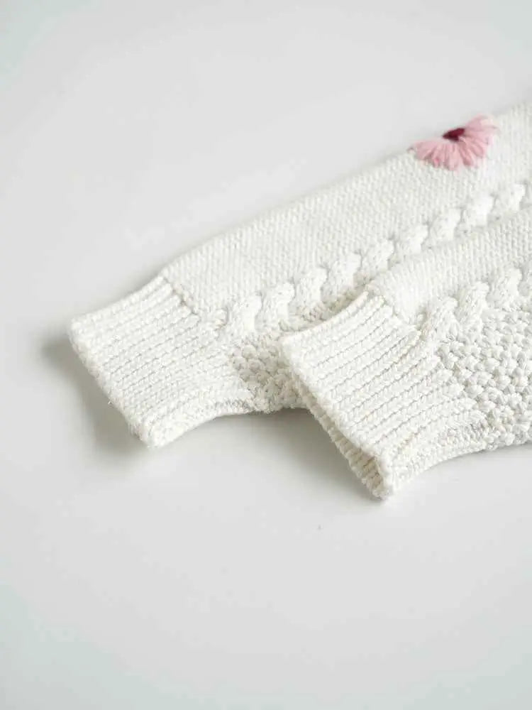Baby girls hand-embroidered floral cotton sweater with white knitted sleeve and pink embroidered flower near cuff