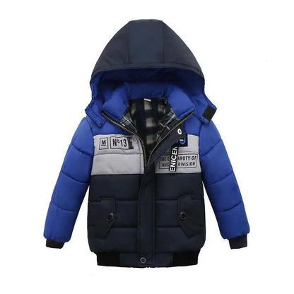 Boys cotton-padded winter jacket in blue and navy with gray panels and black text patches from trend den winter jacket collection 4style