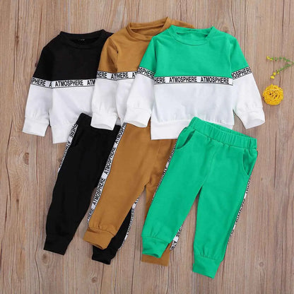 Boys long-sleeve letter suit and stretch trousers in solid black, mustard yellow, and green with white panels and atmosphere lettering