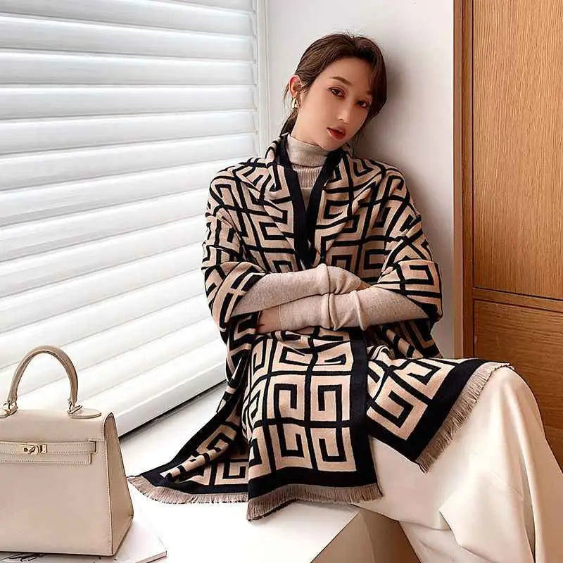 Beige and black geometric patterned knit shawl with fringed edges from the british classic cashmere double sided scarf Black and khaki