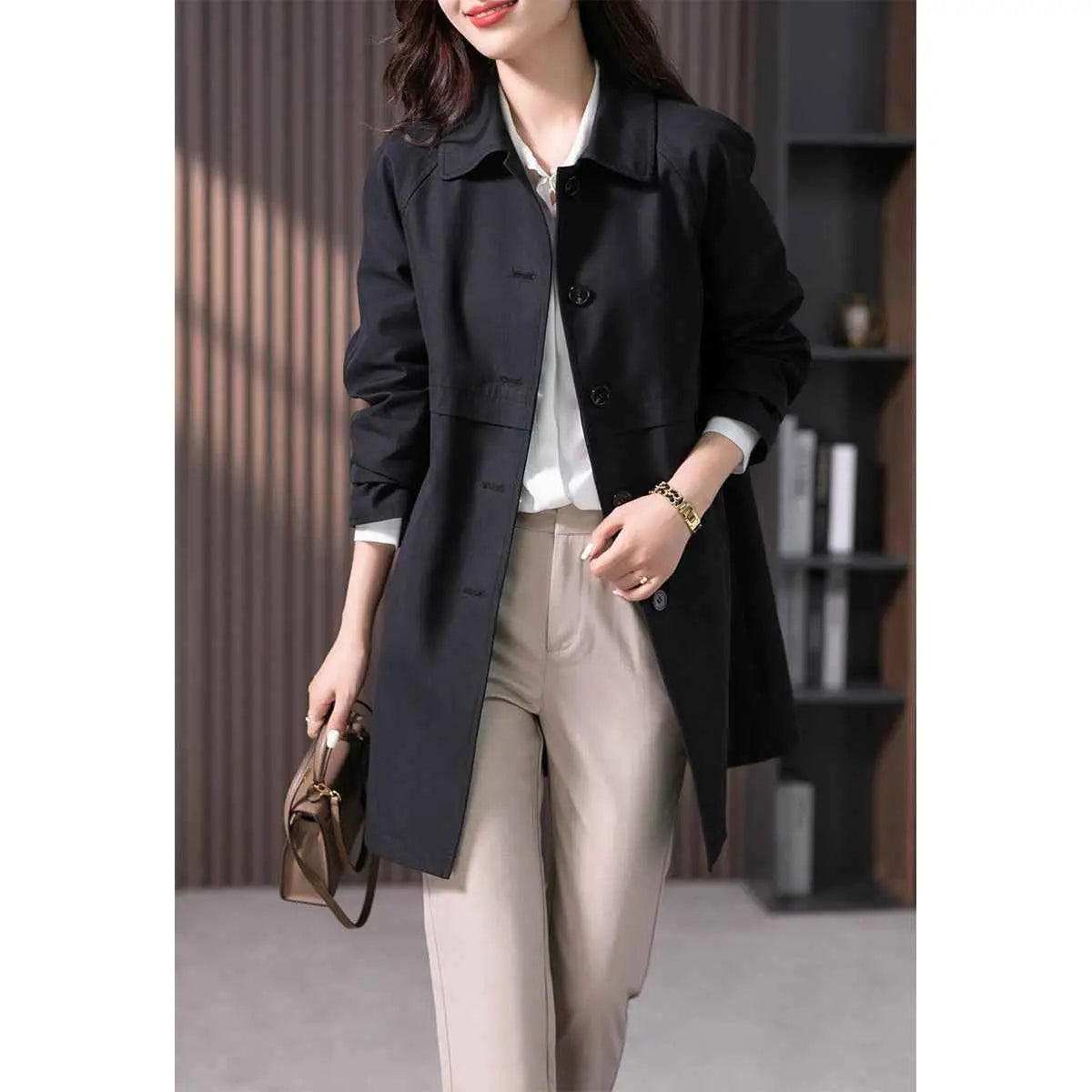 British elegant black trench coat mid-length with classic double-breasted design and subtle button detailing Black