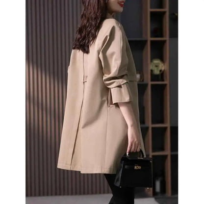 Beige british elegant mid-length trench coat with rolled-up sleeves and a sleek modern straight design