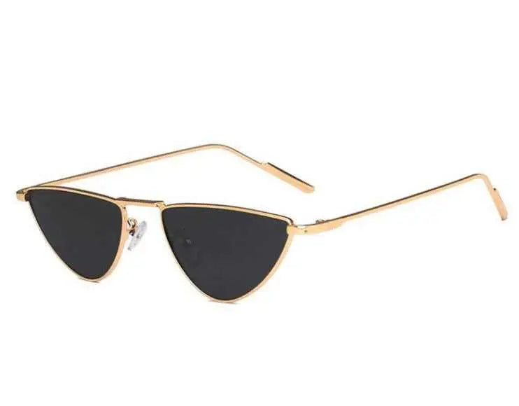 Celebrity street-style gold-toned slim metal sunglasses with dark lenses and a sleek minimalist design from trend den Gold frame grey sheet