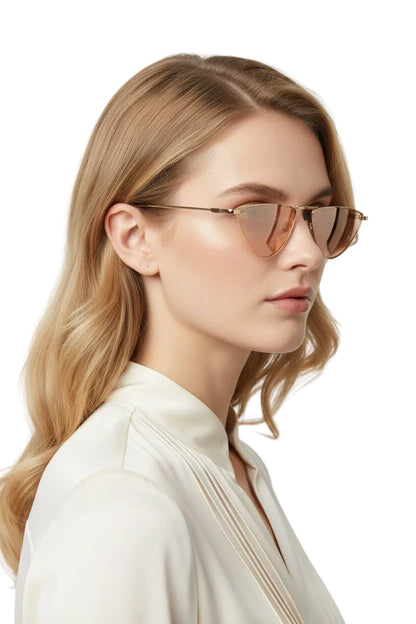 Gold-toned slim metal sunglasses with cat-eye shape and peach-tinted lenses from celebrity street-style trend den collection Gold Frame Light Tea