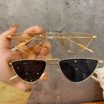 Gold-framed slim metal sunglasses with cat-eye shape and gradient dark lenses from trend den celebrity street-style collection