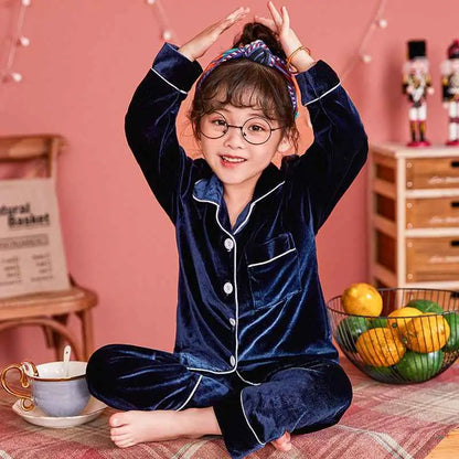Navy blue velvet pajama set with white piping and buttons from trend den featuring a children’s gold velvet cotton style Blue