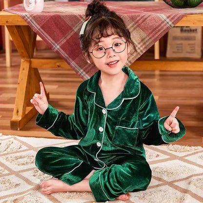 Children’s gold velvet cotton pajama set with emerald green velvet fabric white piping and button closures from trend den Green