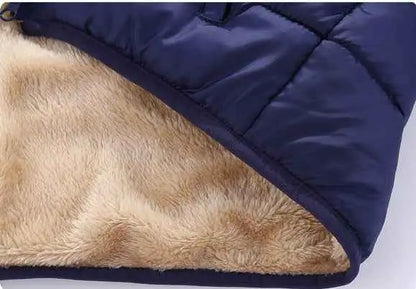 Children’s navy blue quilted winter coat with tan plush faux fur lambskin lined for warmth and style trend den lined coat