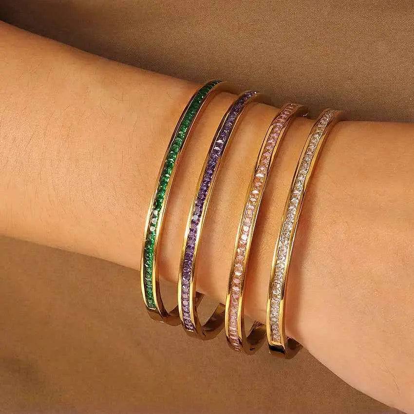 Four gold-toned crystal inlaid slim bangles with colorful faceted stones in stainless steel 2mm design