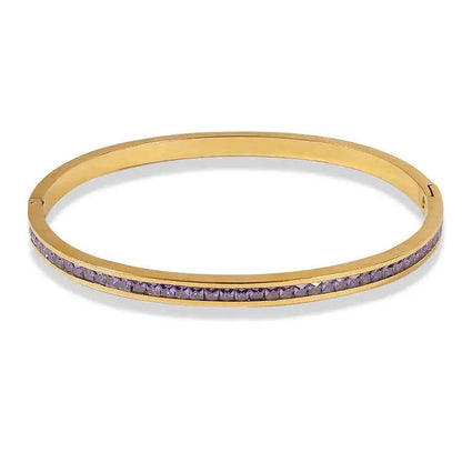 Gold-toned crystal inlaid slim stainless steel bangle bracelet with a row of faceted purple stones, 2mm wide Purple