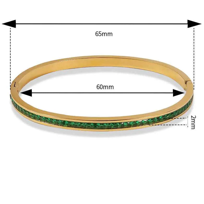 Gold-toned crystal inlaid slim bangle with vibrant green emerald stones on stainless steel base