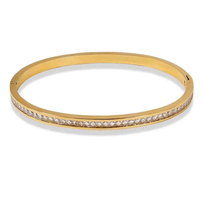 Gold-toned stainless steel crystal inlaid slim bangle bracelet with a single row of clear faceted stones