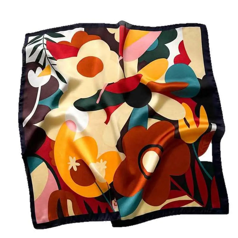 A vibrant dopamine-print silk feel square scarf with bold orange red teal floral pattern and dark navy border