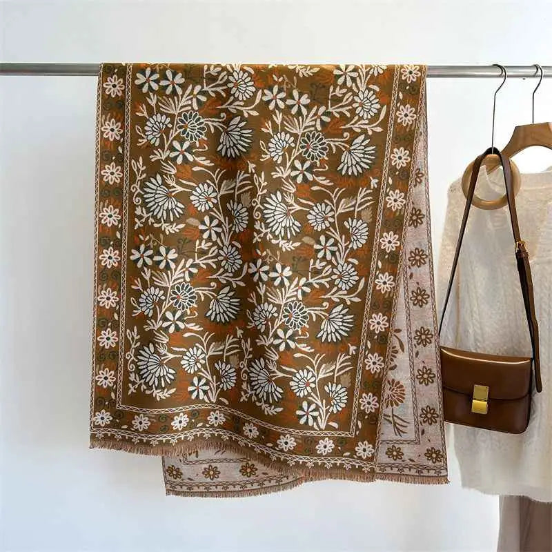 A warm brown floral cashmere-feel oversized shawl with white beige embroidery and fringed edges from trend den WT91 2