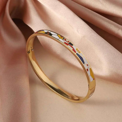 Floral enamel gold bangle in titanium steel featuring a vibrant abstract design with red yellow blue and white shapes Black And White Red