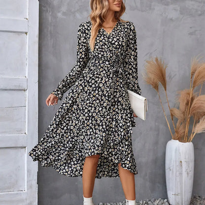 Black and white floral ruffled long sleeve wrap dress with v neckline cinched waist and asymmetrical hem