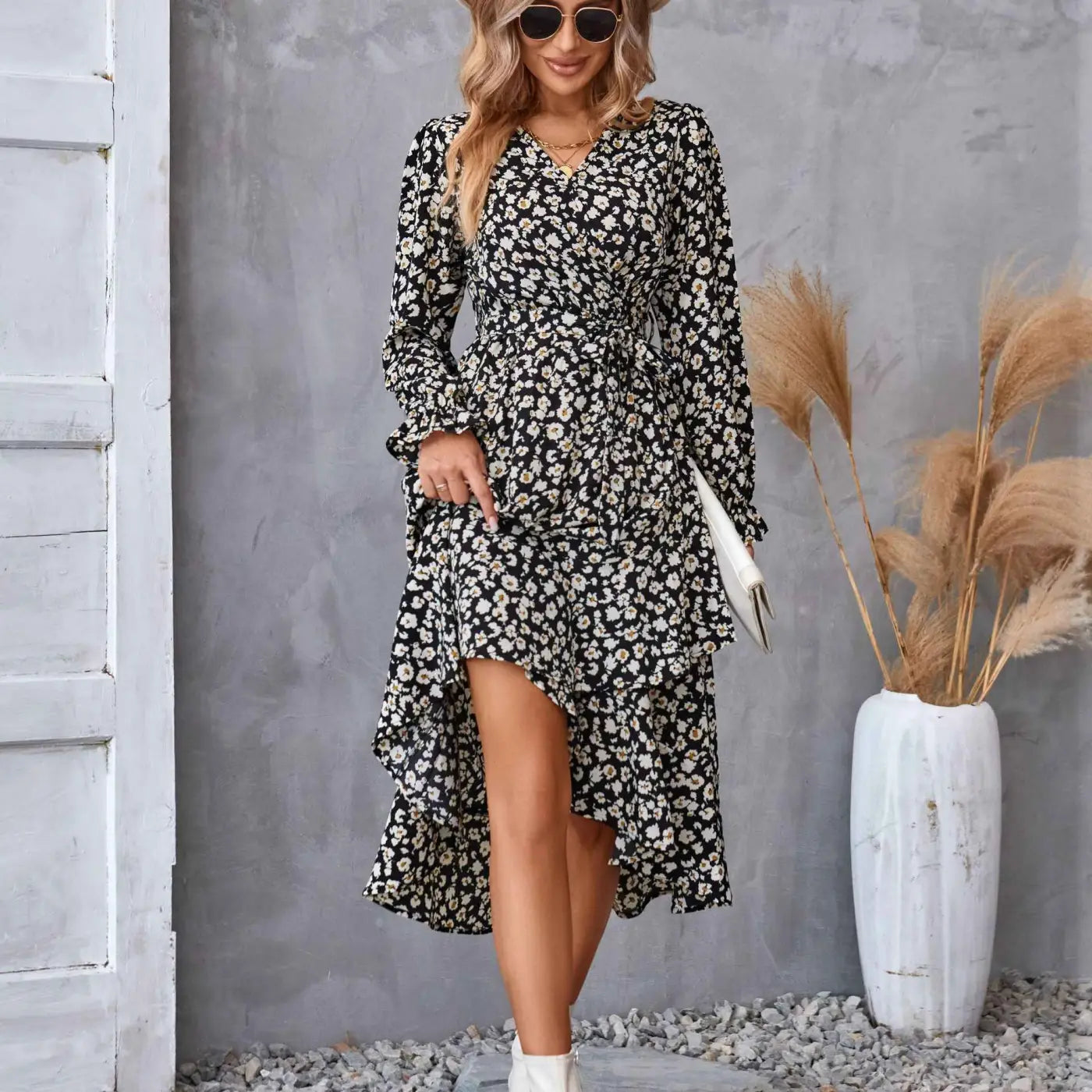 Black and white floral ruffled long sleeve dress with high low hemline and wrap design for elegant occasions Black