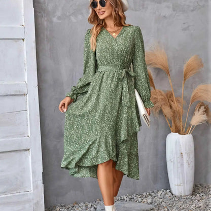 A flowing green floral ruffled long sleeve wrap dress with a cinched waist perfect for elegant occasions Green