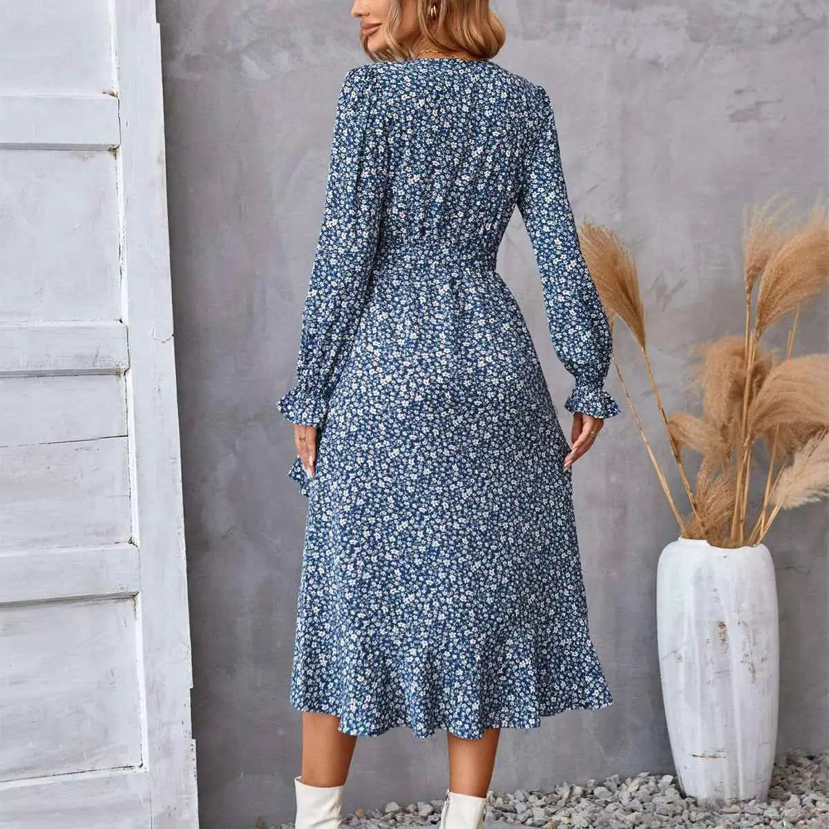 Navy blue floral ruffled long sleeve midi dress with ruffled hem perfect for elegant occasions