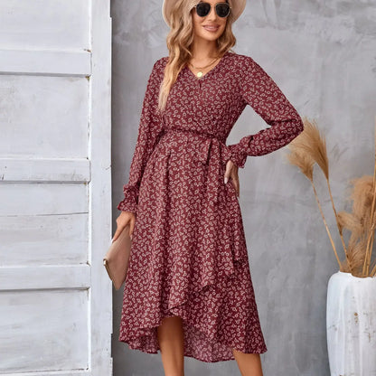 A flowing maroon floral ruffled long sleeve dress with midi length and a belted waist for elegant occasions Red