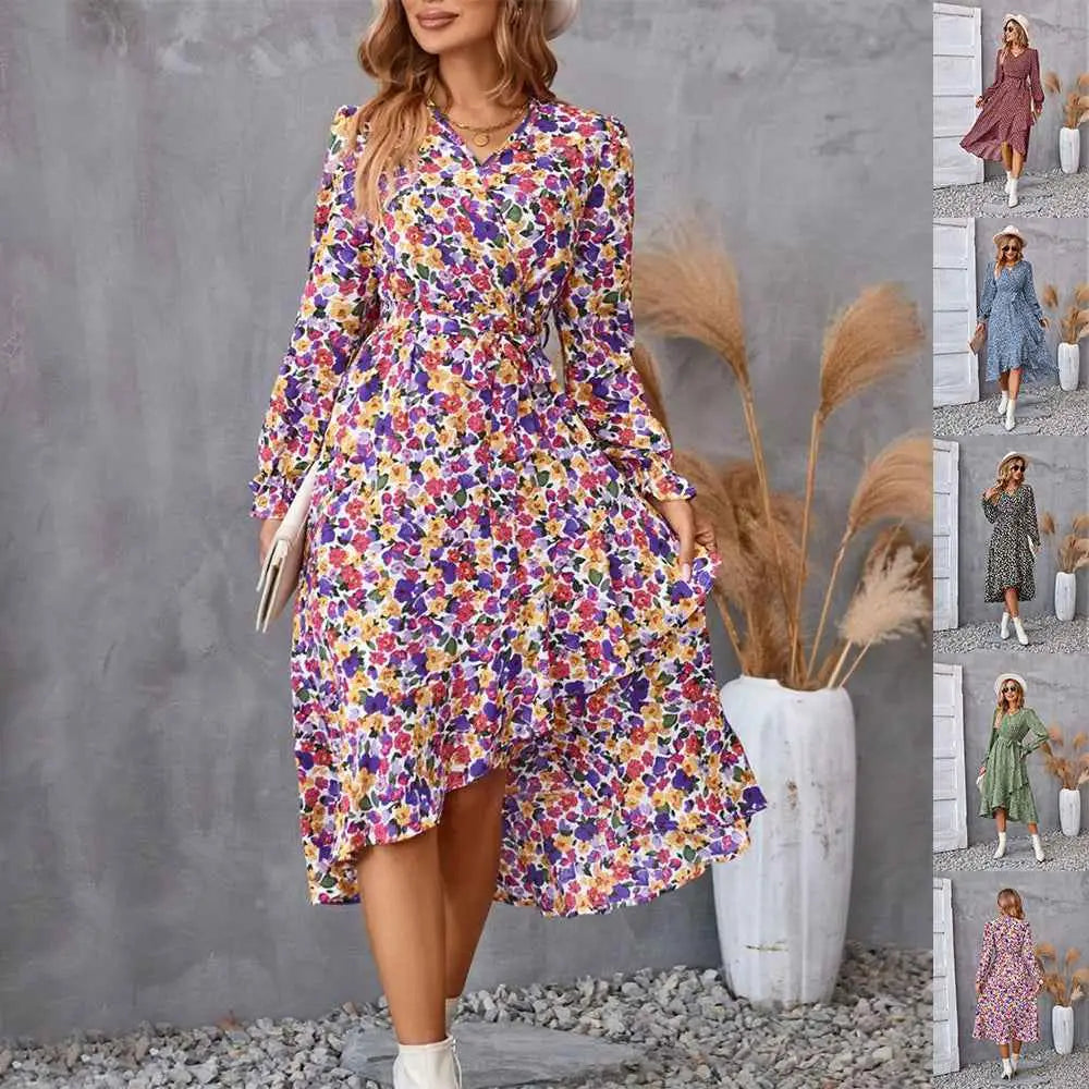 A vibrant floral ruffled long sleeve midi dress with v-neckline and asymmetrical hem in lightweight fabric