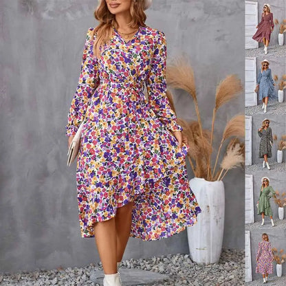 A vibrant floral ruffled long sleeve midi dress with v-neckline and asymmetrical hem in lightweight fabric