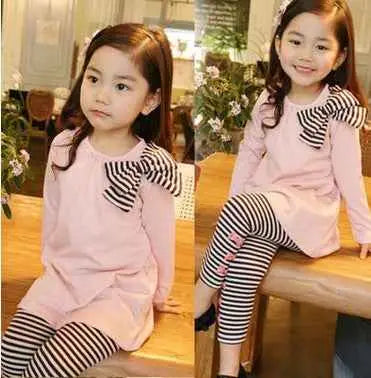Pink long-sleeved girls bow accent tunic with black and white striped leggings from trend den set