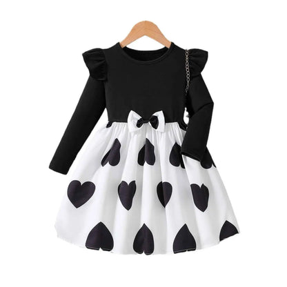 Black and white heart patterned toddler princess dress with ruffled sleeves and waist bow from trend den cartoon princess dress