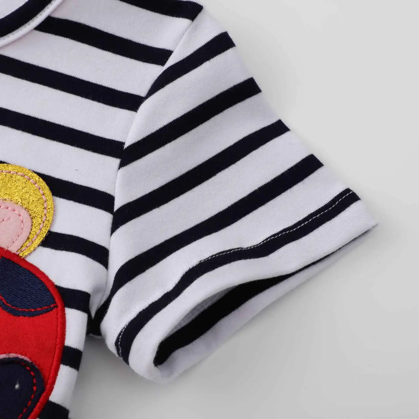 Girls casual short-sleeve print dress with white and navy stripes and colorful cartoon appliqué on chest from trend den