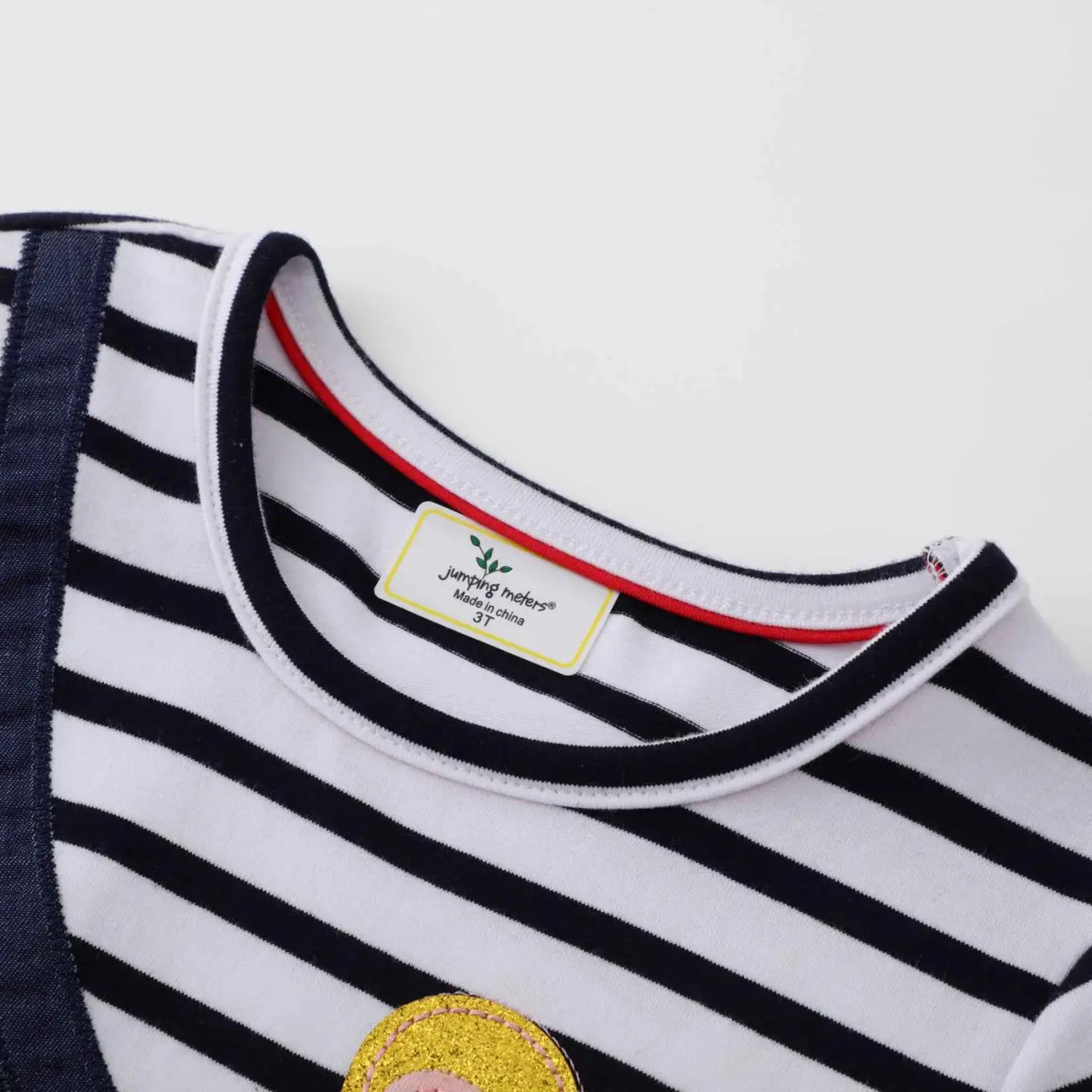 Girls casual navy and white striped print dress with round neckline and yellow glittery patch on front for trend den style