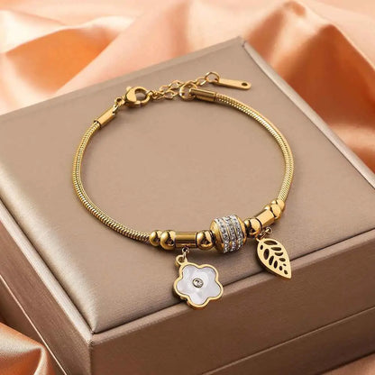 Gold shell charm bracelet with gold-toned snake chain titanium steel featuring crystal bead and floral leaf charms Five Petal Flower
