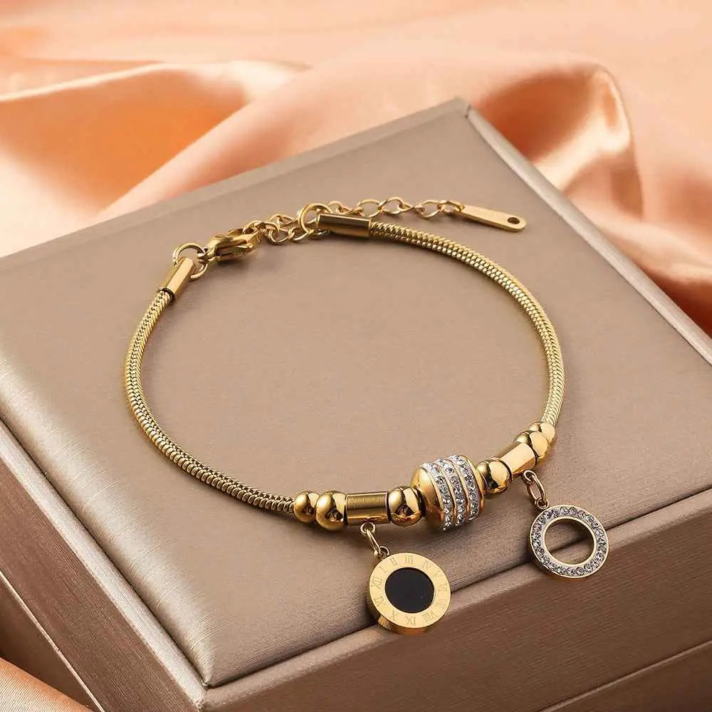 Gold-toned titanium steel charm bracelet with rhinestone barrel bead and gold shell charm adjustable design Hollow Double Round