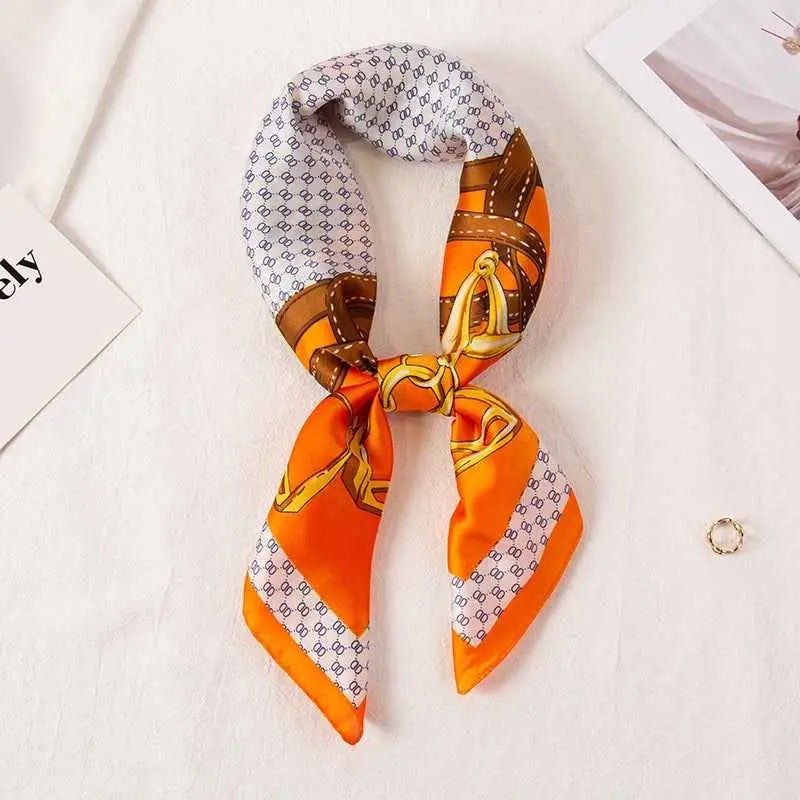 High-end 90cm floral vibrant orange silk scarf with gold chain motif and white patterned borders tied into a knot Scarf Buckle Orange
