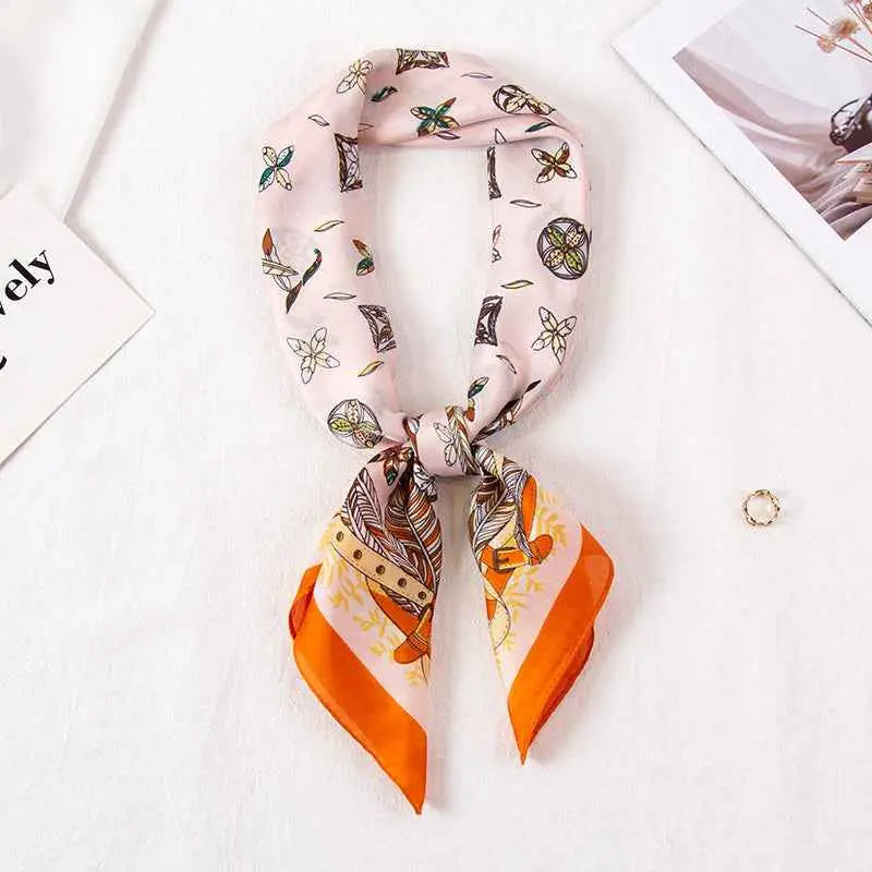 High-end 90cm floral silk feel scarf in pink and orange with botanical and butterfly print tied in elegant knot Leaves Pink