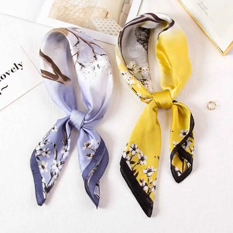 Two high-end 90cm floral silk scarves in lavender with white florals and vibrant yellow with black accents from trend den