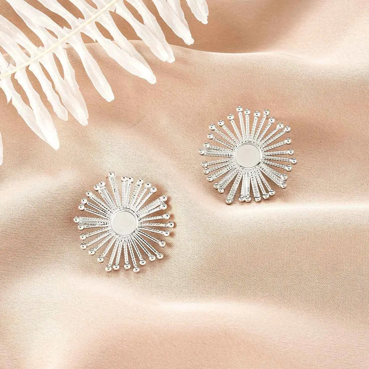Silver sunburst-style stud earrings with mirrored disc and beaded rays from ins style gold fashion earring collection Style 11