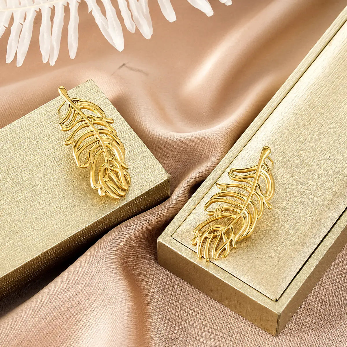 Gold feather-shaped metal clasps on gold boxes from ins style gold fashion earring collection for affordable luxury Style 18