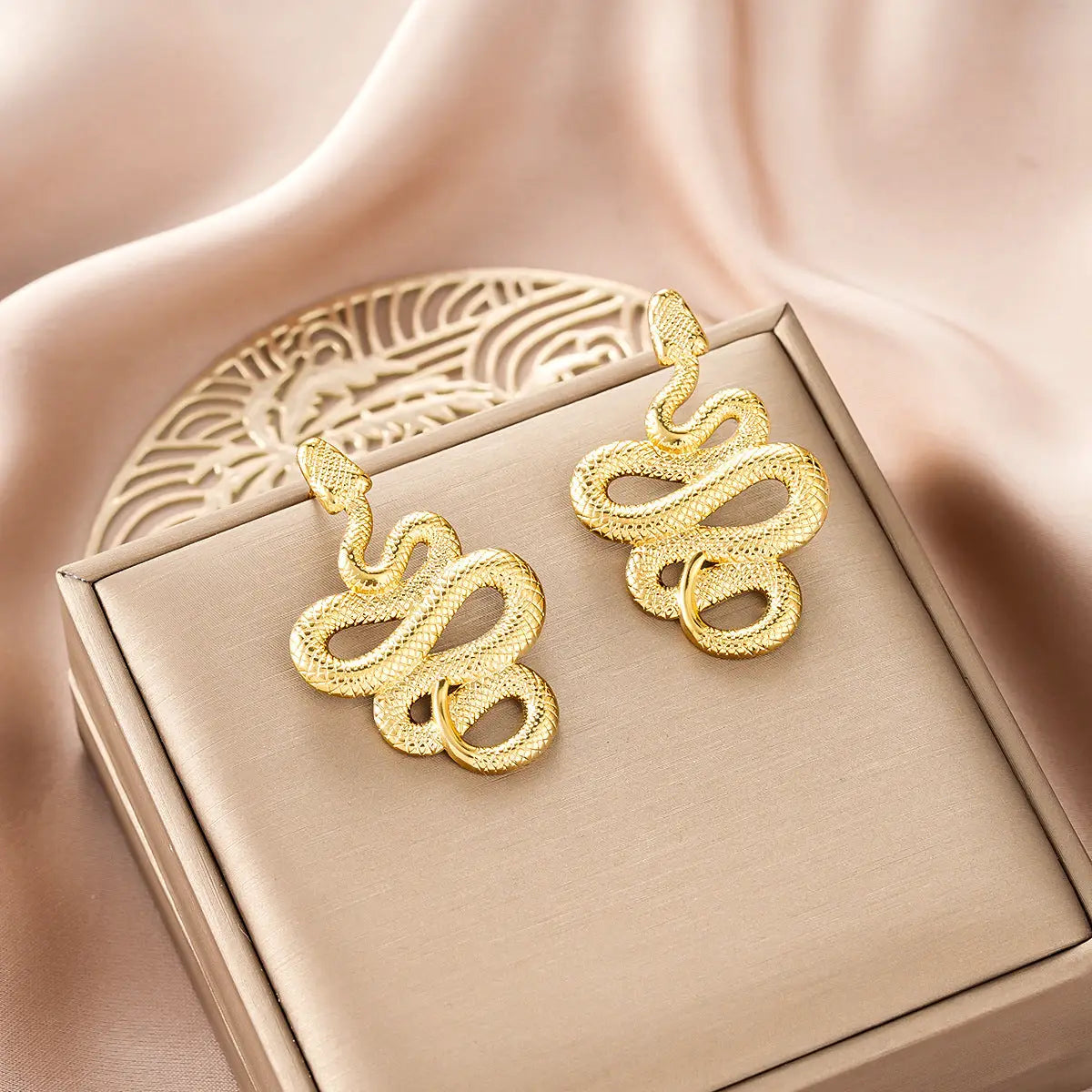 Gold snake-shaped earrings with textured scaly surface from ins style gold fashion earring collection affordable luxury Style 19