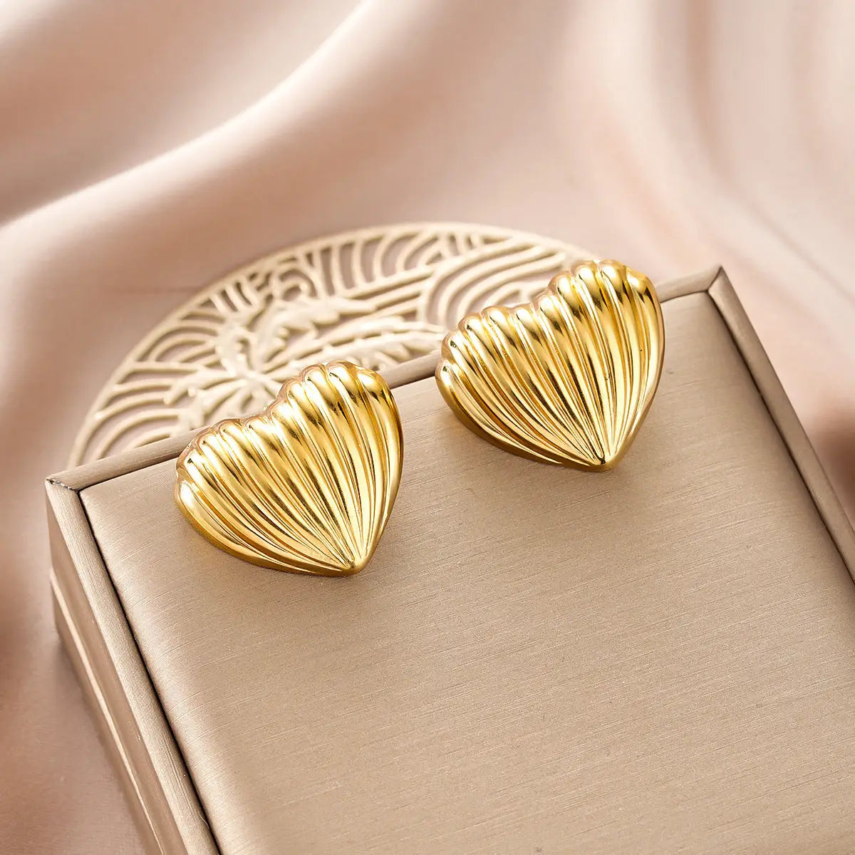 Gold heart-shaped stud earrings with ribbed shell-like texture from ins style gold fashion earring collection Style 24