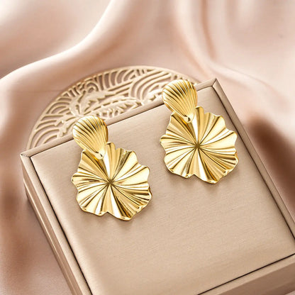 Gold fashion earring from ins style earring collection featuring leaf shape sunburst design with ridged detailing Style 26