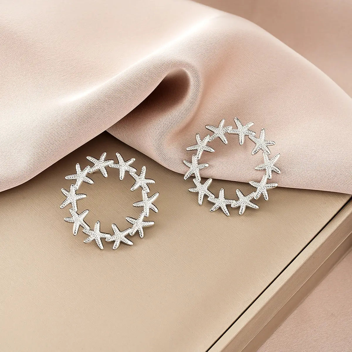 Silver starfish-shaped hoop earrings with a sparkling finish from ins style gold fashion earring collection affordable luxury Style 29