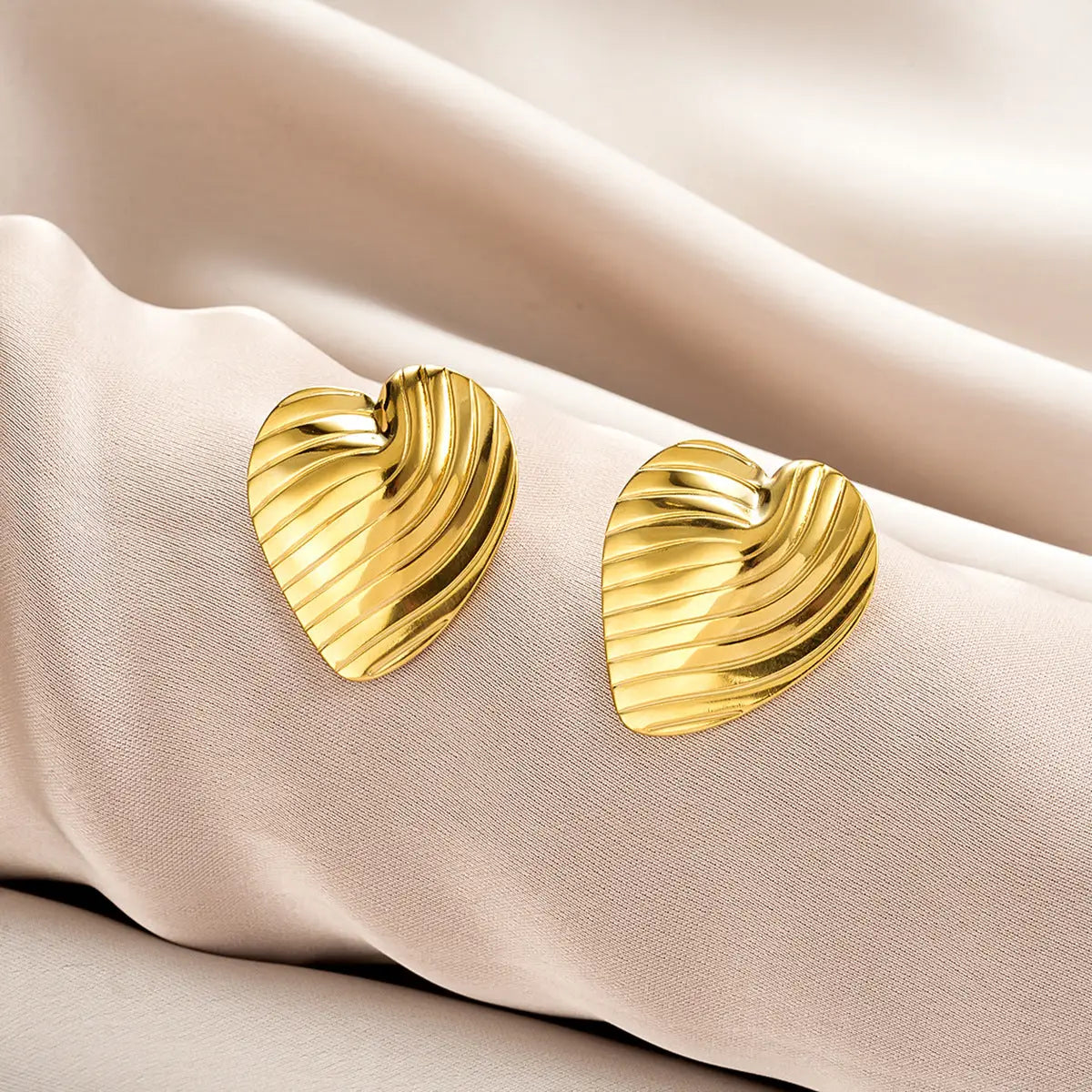 Gold heart-shaped earrings with textured ribbed surface from ins style affordable luxury gold fashion earring collection Style 30