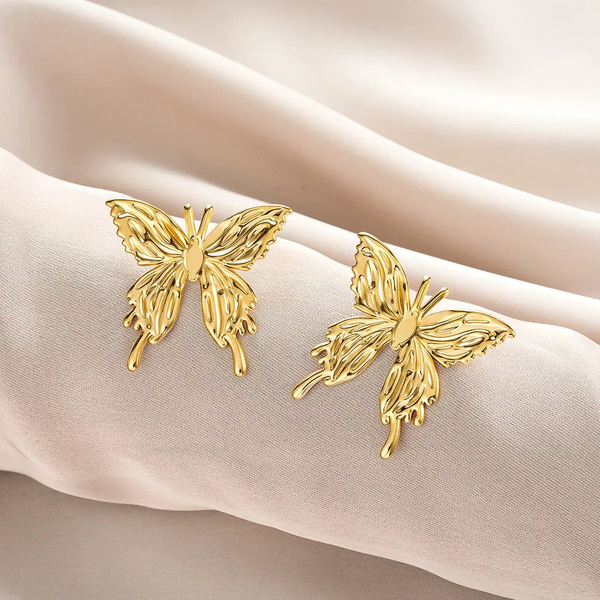 Gold butterfly-shaped stud earrings with intricate wings and polished finish from ins style affordable luxury earring collection Style 31