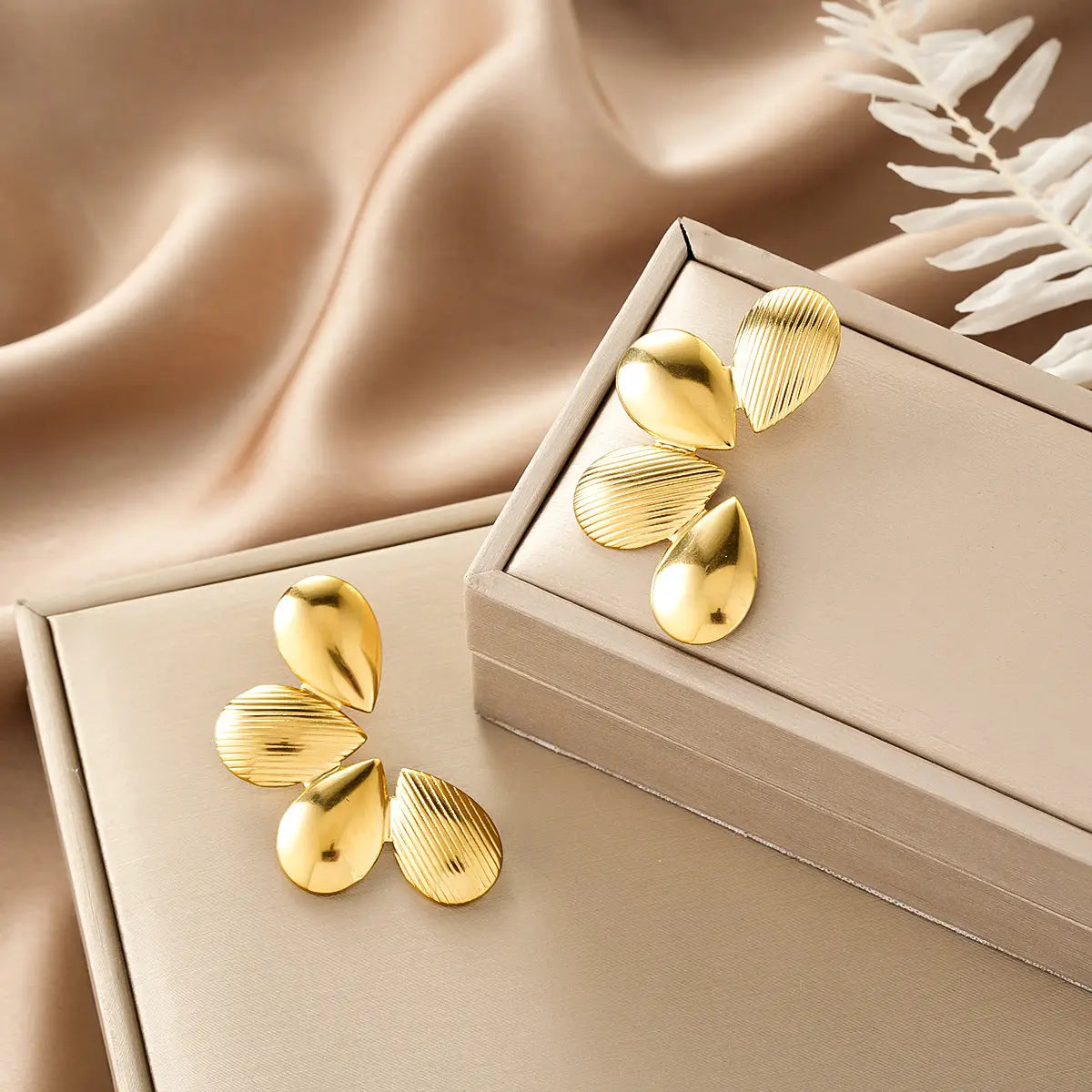 Gold teardrop-shaped earrings with textured ribbed surface from ins style gold fashion earring collection affordable luxury Style 33