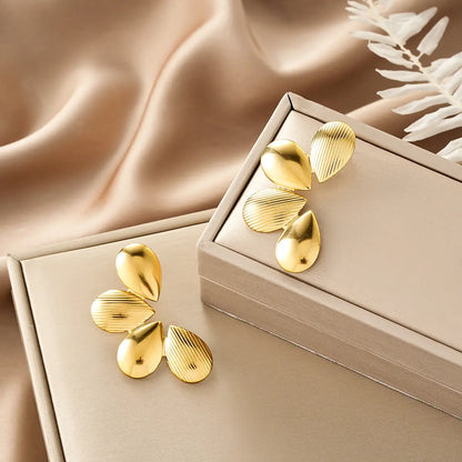 Gold teardrop-shaped earrings with textured ribbed surface from ins style gold fashion earring collection affordable luxury Style 33